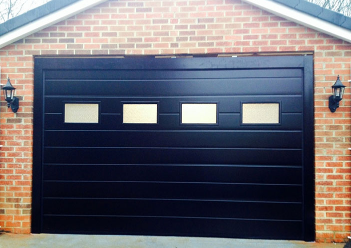 Alutech M-Ribbed Smooth sectional garage door glazed in Black RAL